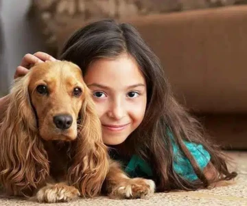 Child and dog enjoying newly cleaned carpet