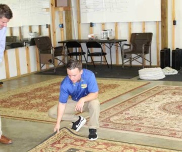 Client being shown safedry method for cleaning carpets